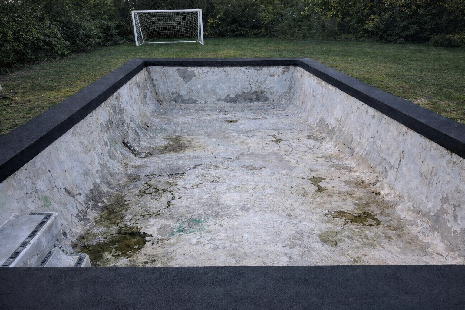 Pool resurfacing Gold Coast — concrete pool before resurfacing, worn marblesheen